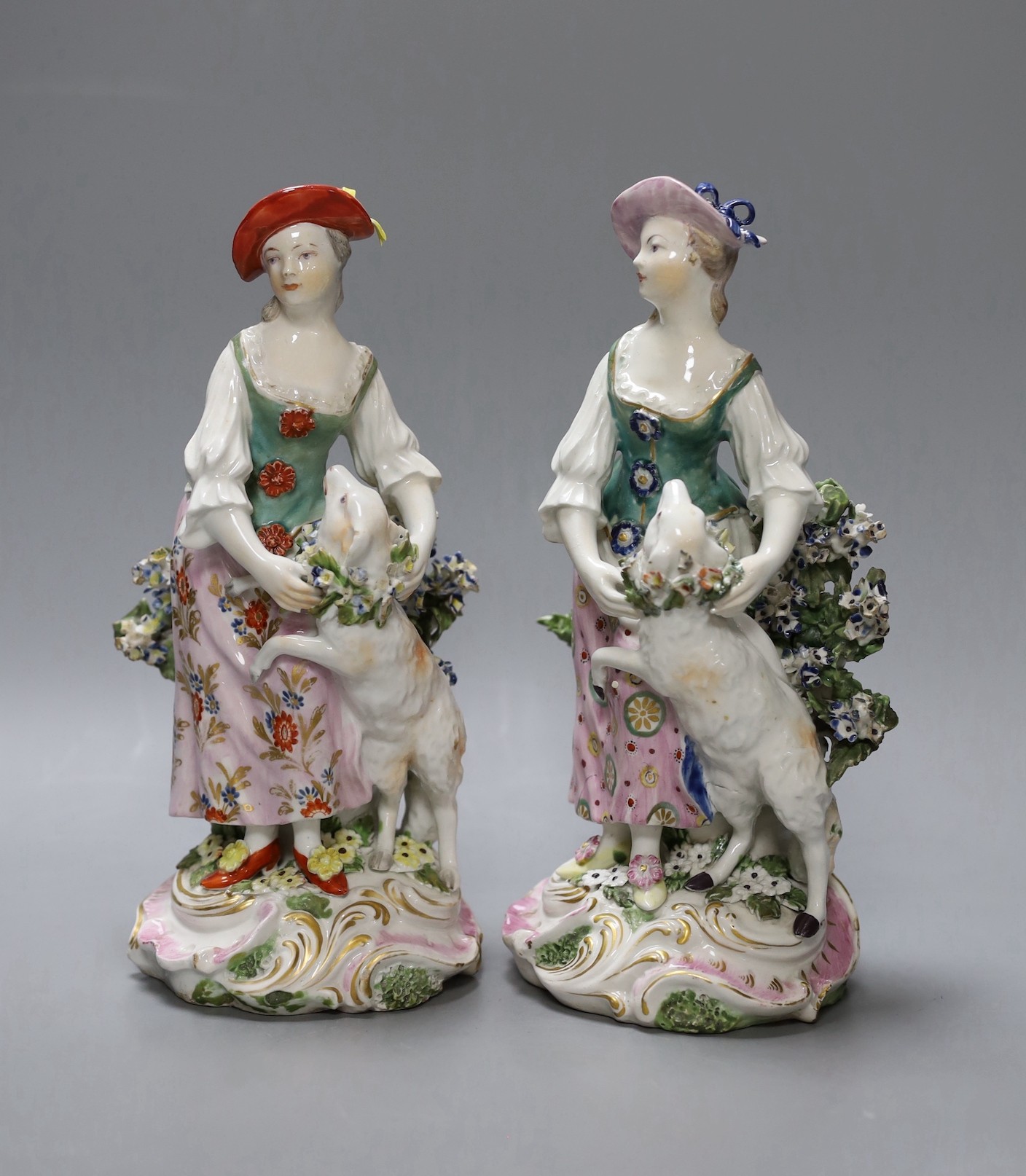 Two Derby groups of a shepherdess and a sheep, c.1765, 21 cms high